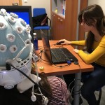 Researcher measuring EEG with tDCS